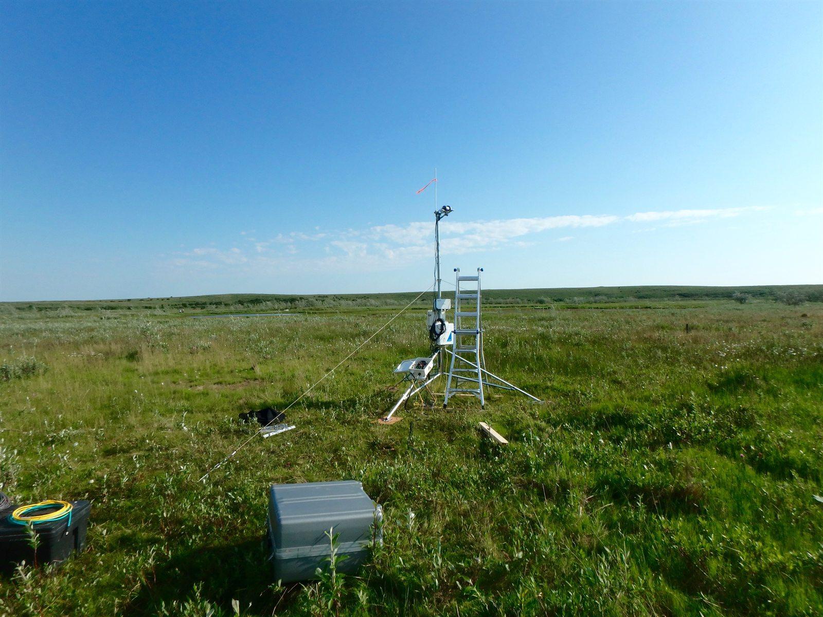 Research instruments being installed on open grassland
